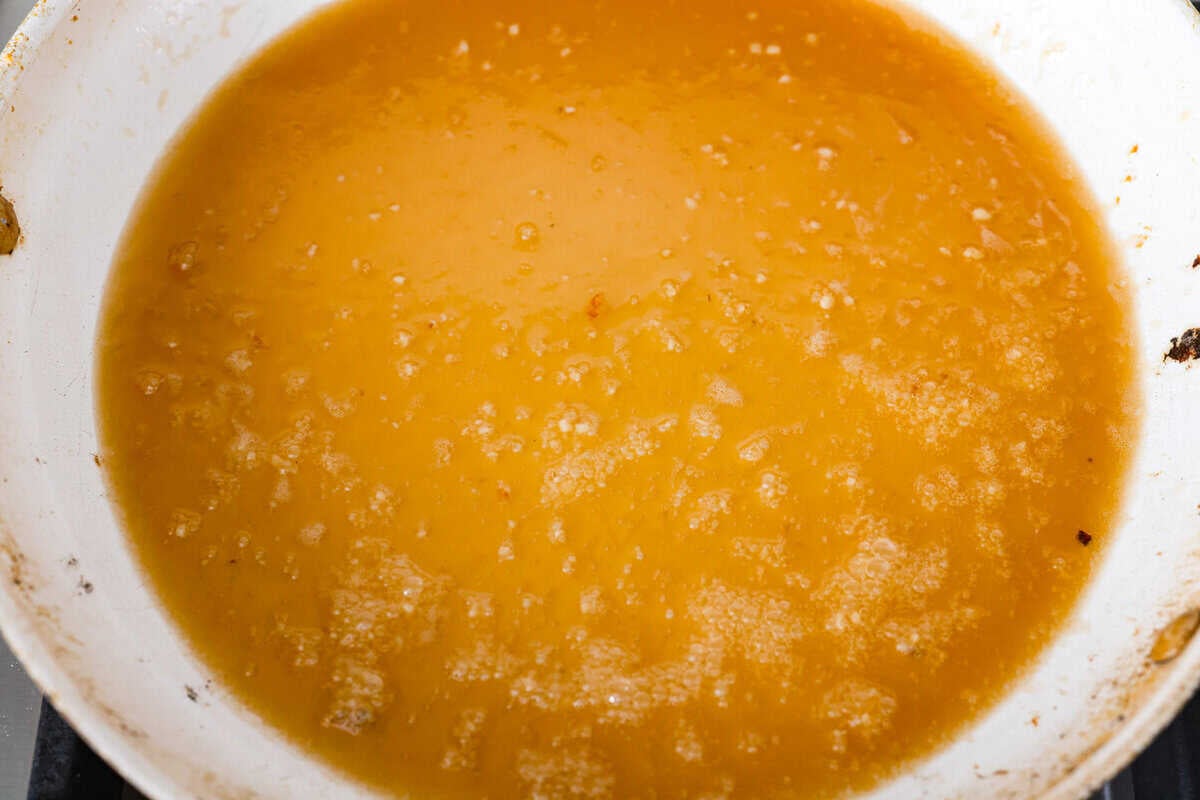 Sauce ingredients simmering in the skillet.