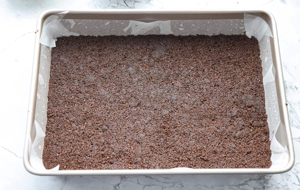 Crust ingredients smashed into the bottom of a pan. 