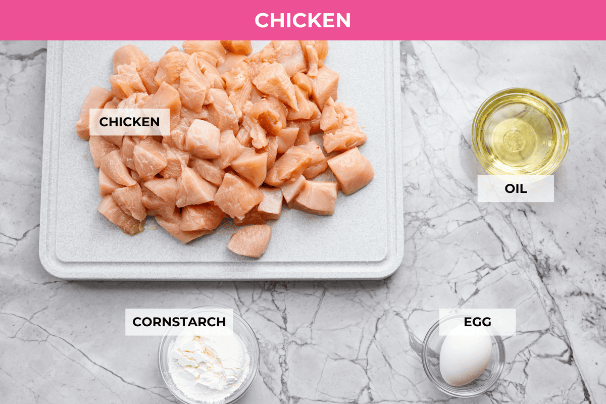 Skip the takeout and make this easy baked General Tso’s chicken at home! It’s crispy, saucy, and perfectly sweet with just the right amount of heat, no deep fryer required. Overhead shot of labeled ingredients.