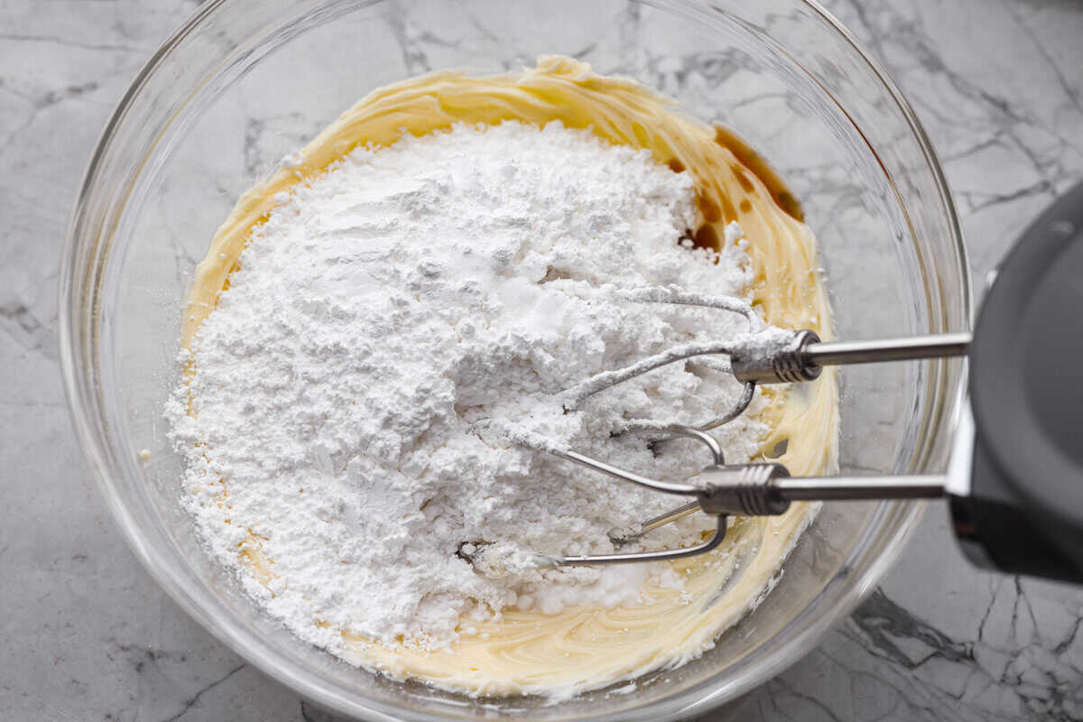 Powdered sugar and flavor extracts added to the chocolate and butter mixture.