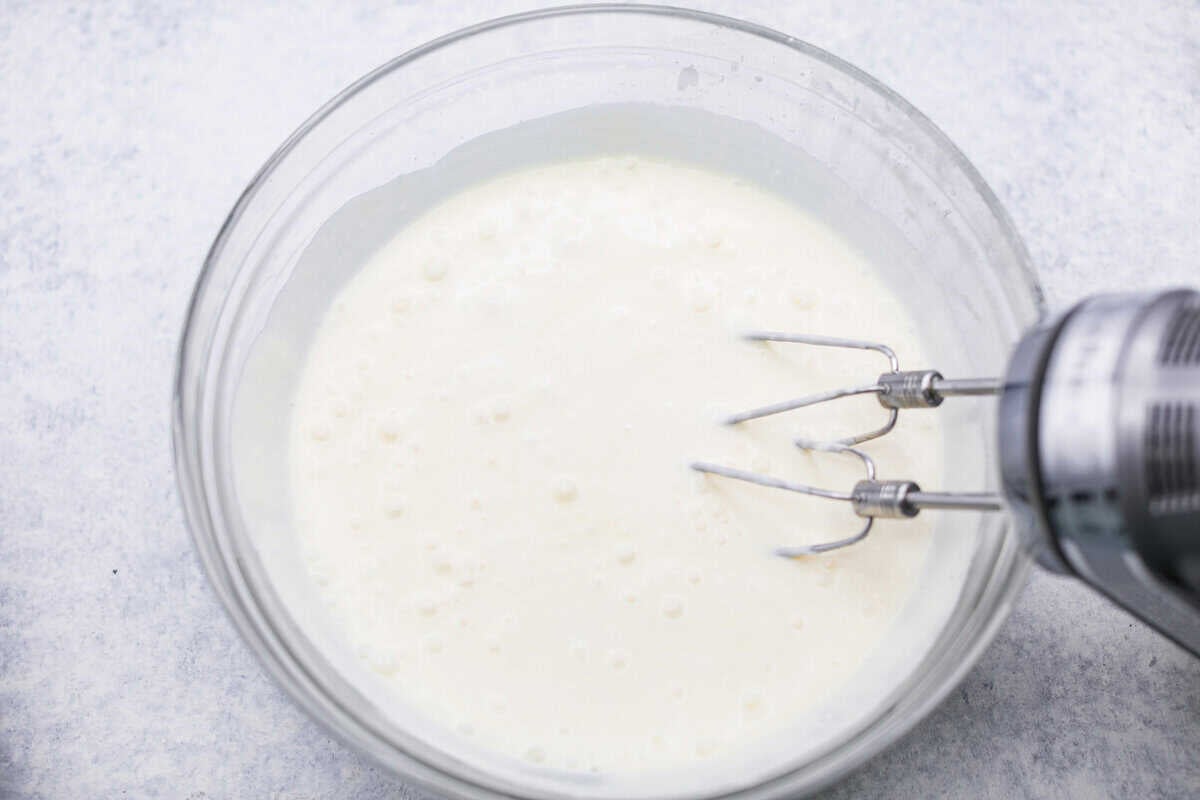 Someone added the gelatin and the cream cheese mixture together with a hand mixture.