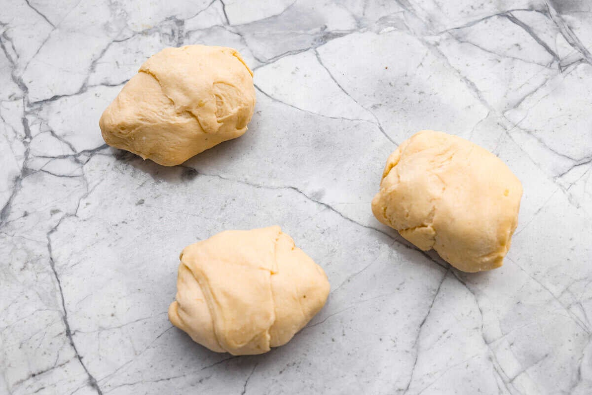 Crescent dough rolled up around the chicken mixture.