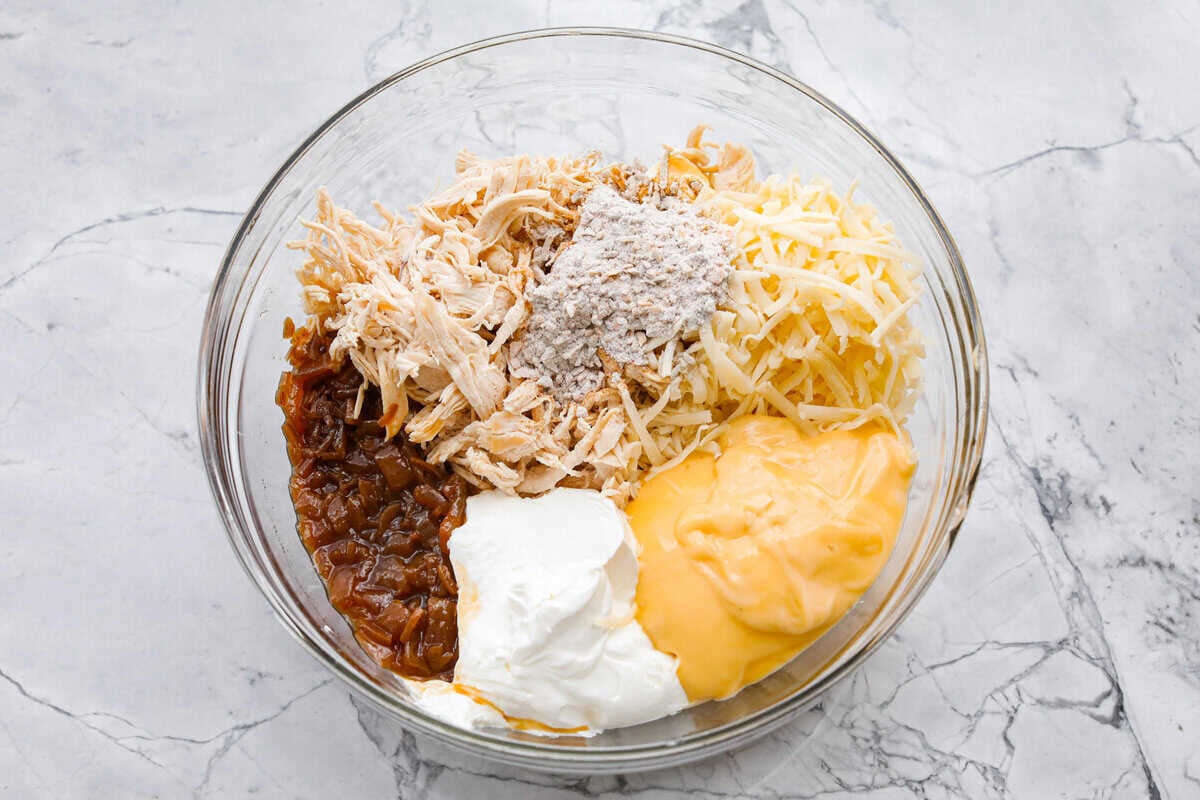 Casserole ingredients all added to a mixing bowl. 