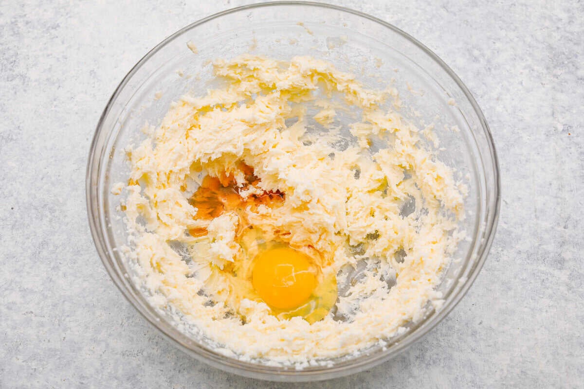 Egg and vanilla added to the beaten butter and sugar. 